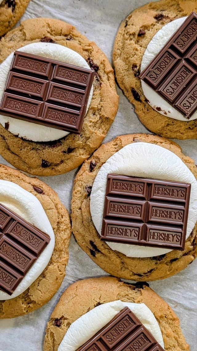 Big cookies with a white topping and squares of milk chocolate