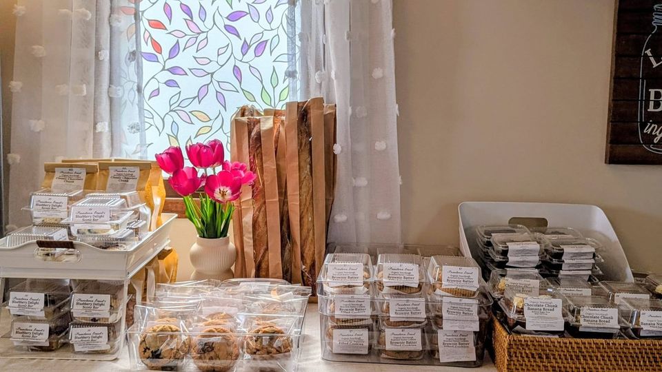 Fresh flowers and packaged bakes on our shop counter