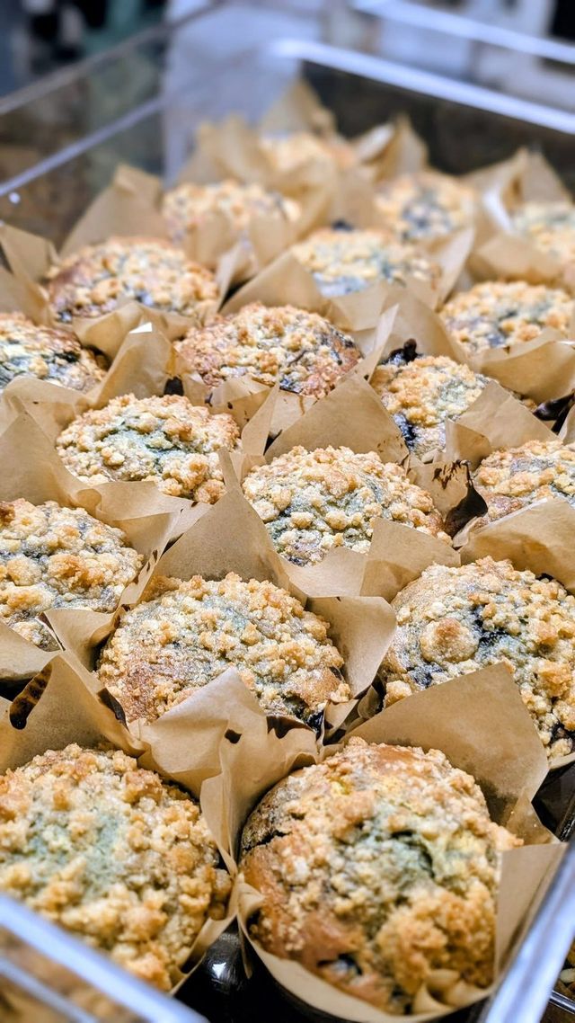 Crumb-topped muffins in parchment wraps